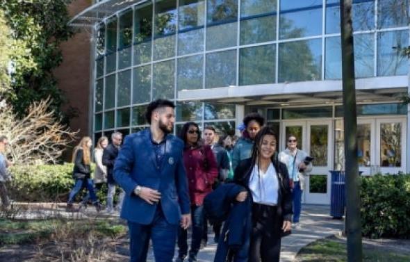 Group of ODU students walking outside of building